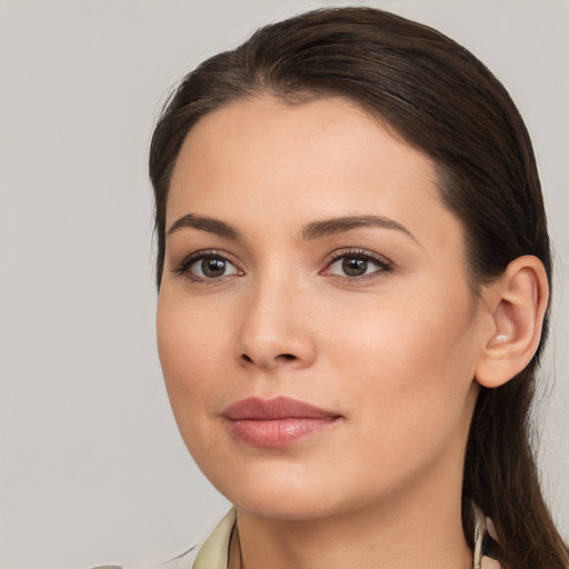 Neutral white young-adult female with long  brown hair and brown eyes