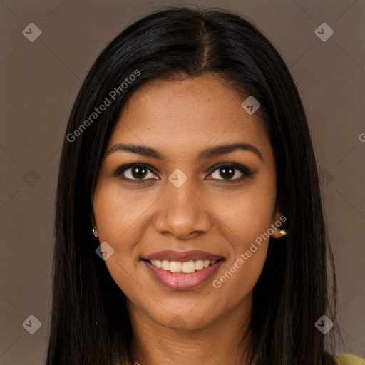 Joyful black young-adult female with long  brown hair and brown eyes