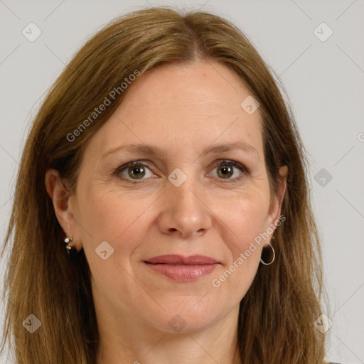 Joyful white adult female with long  brown hair and brown eyes