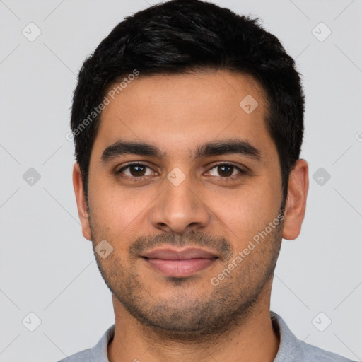 Joyful latino young-adult male with short  black hair and brown eyes