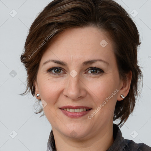 Joyful white adult female with medium  brown hair and grey eyes