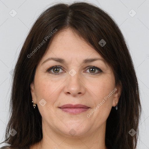 Joyful white adult female with long  brown hair and brown eyes