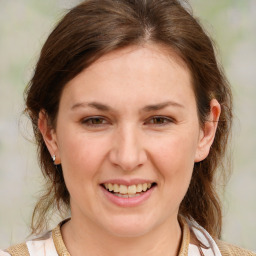 Joyful white young-adult female with medium  brown hair and blue eyes