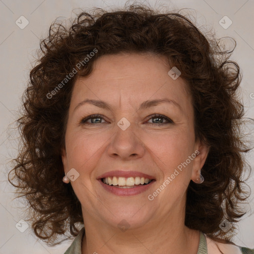 Joyful white adult female with medium  brown hair and green eyes