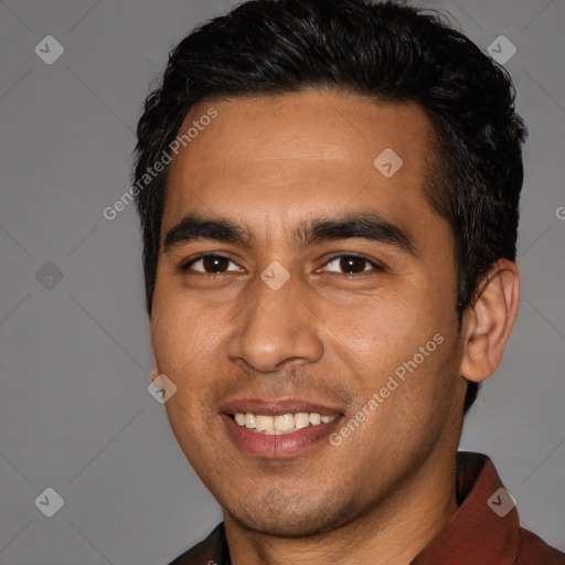 Joyful white young-adult male with short  black hair and brown eyes