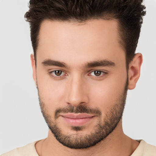 Joyful white young-adult male with short  brown hair and brown eyes