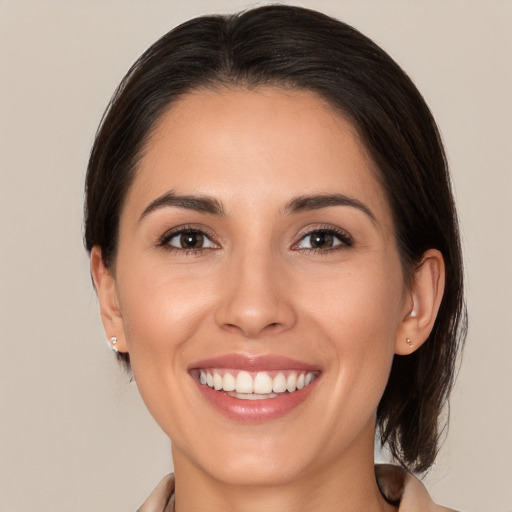 Joyful white young-adult female with medium  brown hair and brown eyes