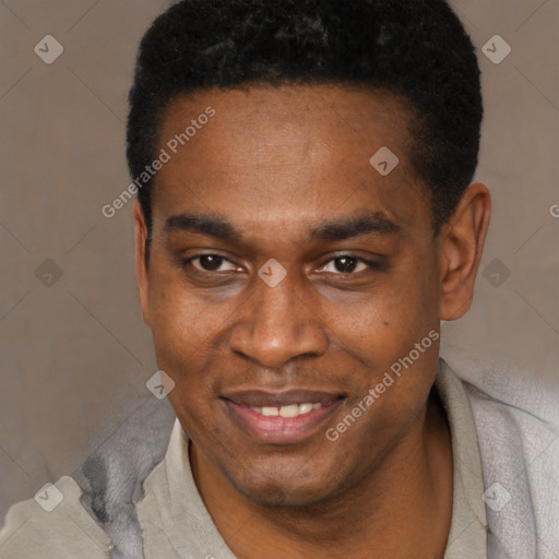 Joyful black young-adult male with short  black hair and brown eyes