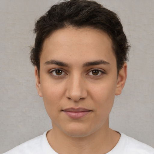 Joyful white young-adult female with short  brown hair and brown eyes