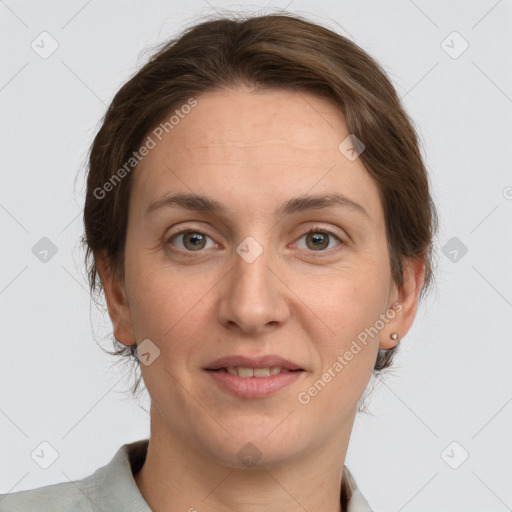 Joyful white adult female with medium  brown hair and grey eyes