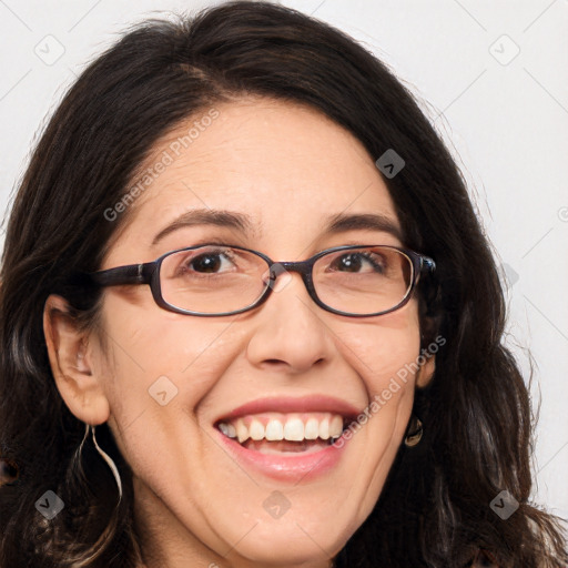 Joyful white adult female with long  brown hair and brown eyes