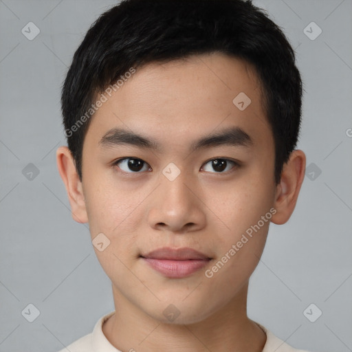 Joyful asian young-adult male with short  brown hair and brown eyes
