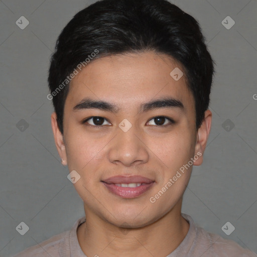 Joyful asian young-adult male with short  brown hair and brown eyes