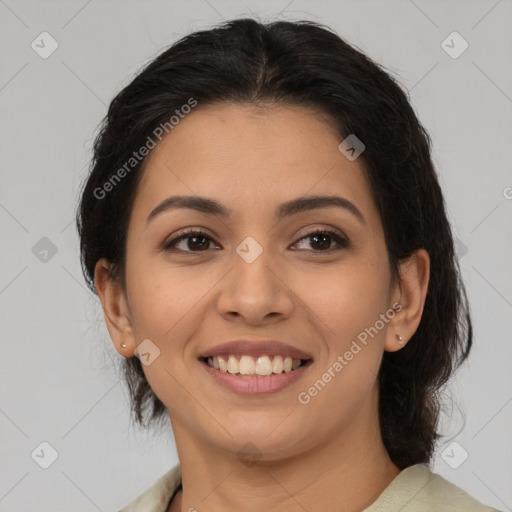 Joyful latino young-adult female with medium  brown hair and brown eyes