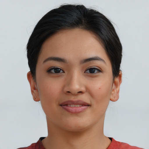 Joyful asian young-adult female with short  brown hair and brown eyes