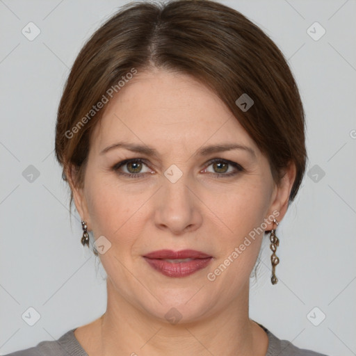 Joyful white adult female with medium  brown hair and grey eyes