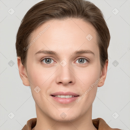 Joyful white young-adult female with short  brown hair and grey eyes