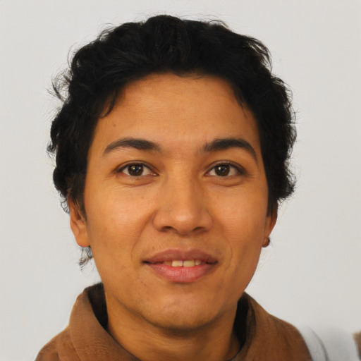 Joyful latino young-adult female with short  black hair and brown eyes
