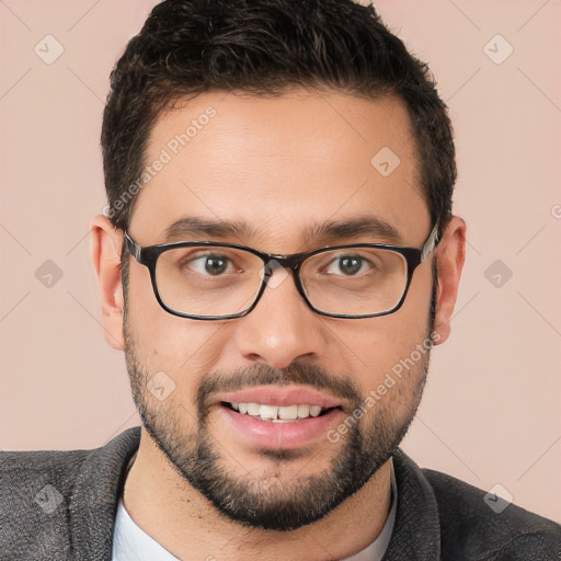 Joyful white young-adult male with short  brown hair and brown eyes