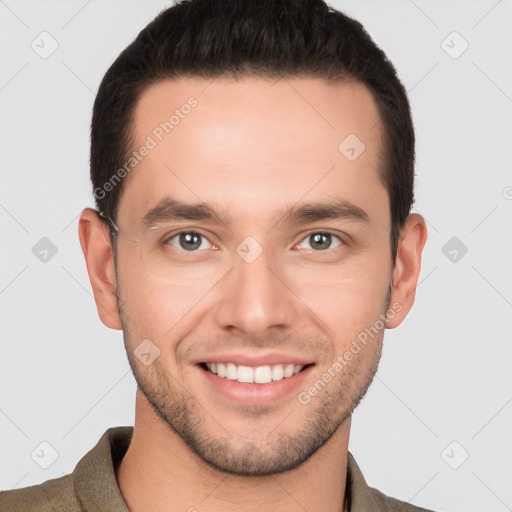 Joyful white young-adult male with short  brown hair and grey eyes