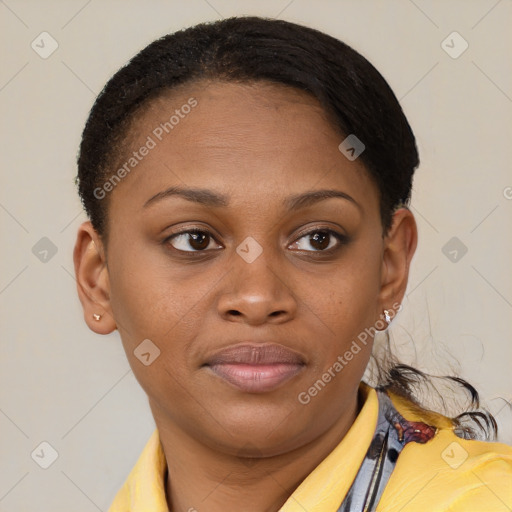 Joyful black young-adult female with short  brown hair and brown eyes