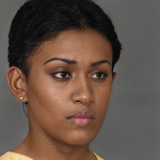 Neutral black young-adult female with short  brown hair and brown eyes