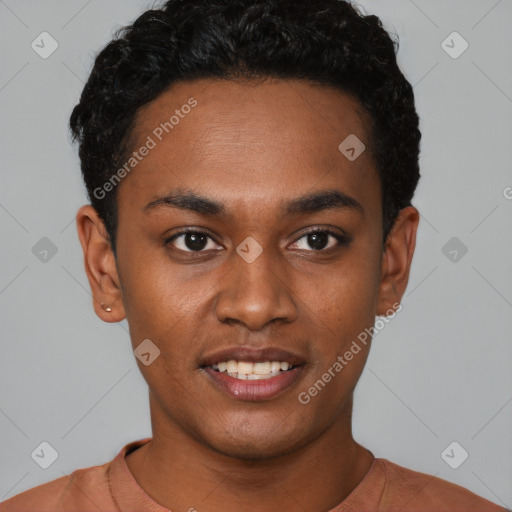 Joyful black young-adult male with short  black hair and brown eyes