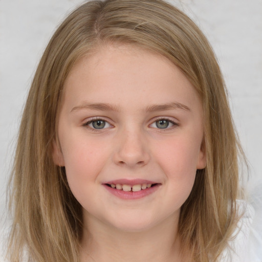 Joyful white child female with medium  brown hair and grey eyes