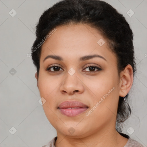 Joyful latino young-adult female with short  brown hair and brown eyes