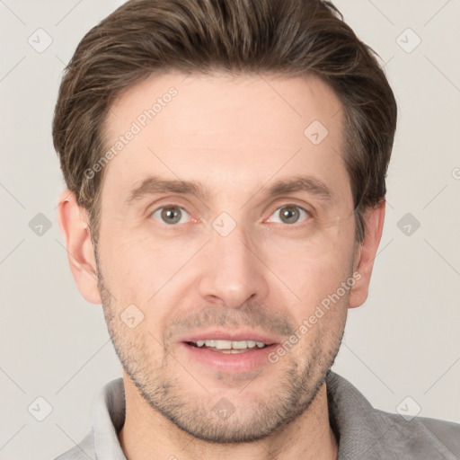 Joyful white adult male with short  brown hair and grey eyes