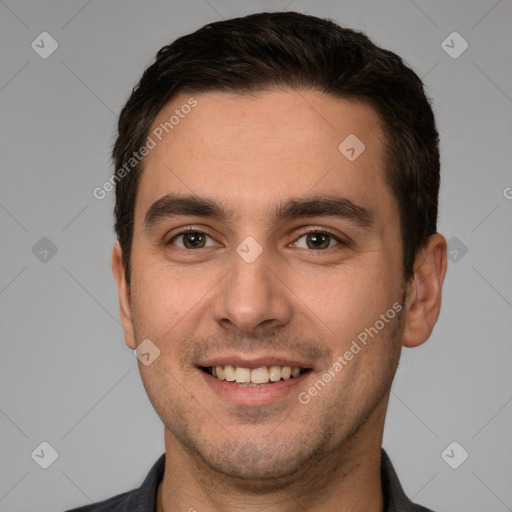 Joyful white young-adult male with short  brown hair and brown eyes