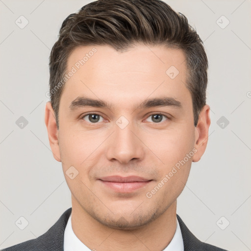 Joyful white young-adult male with short  brown hair and brown eyes