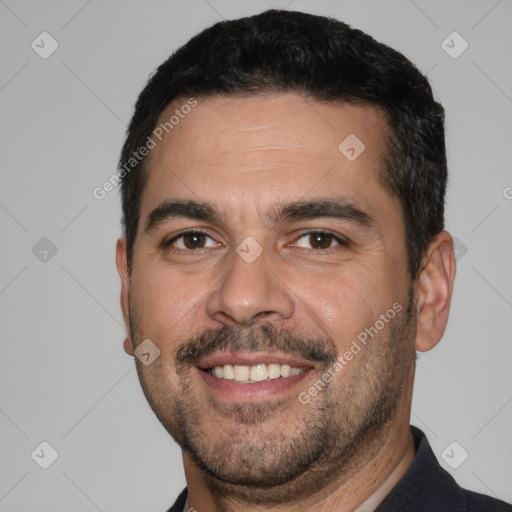 Joyful white young-adult male with short  black hair and brown eyes