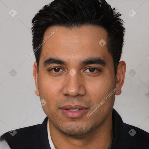 Joyful white young-adult male with short  black hair and brown eyes