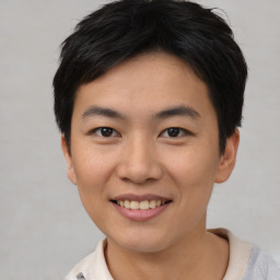 Joyful asian young-adult female with short  black hair and brown eyes