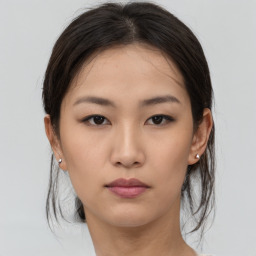 Neutral asian young-adult female with medium  brown hair and brown eyes