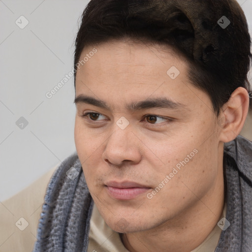 Joyful latino young-adult male with short  black hair and brown eyes