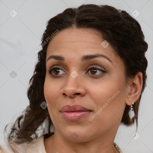 Joyful black young-adult female with medium  brown hair and brown eyes