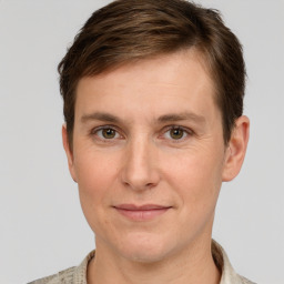 Joyful white adult male with short  brown hair and grey eyes