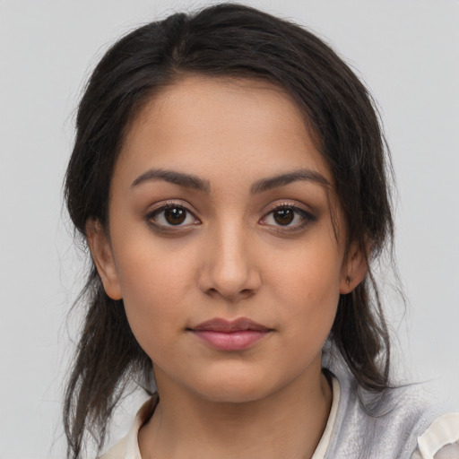 Neutral latino young-adult female with medium  brown hair and brown eyes