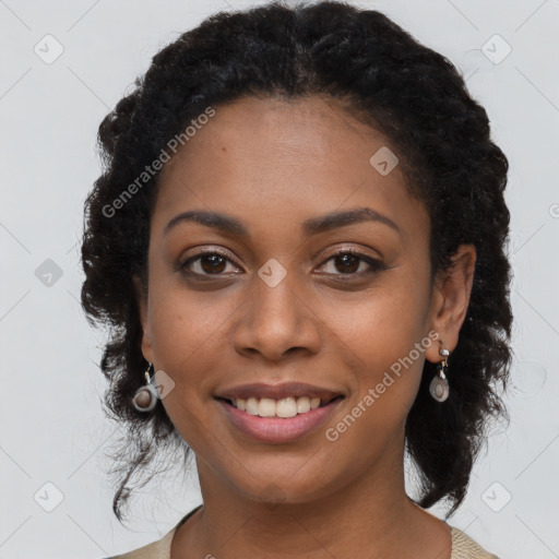 Joyful black young-adult female with long  brown hair and brown eyes