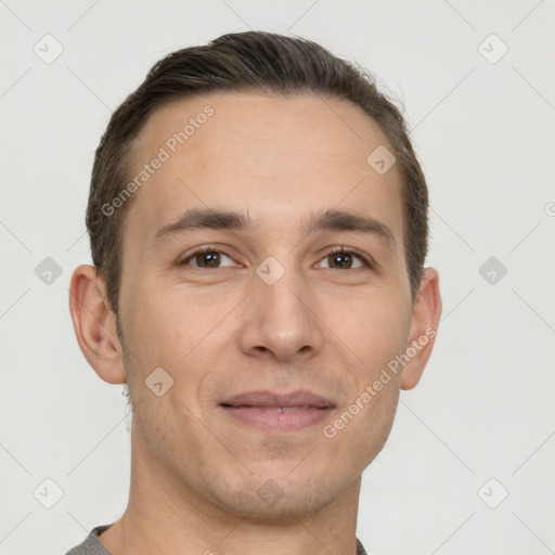 Joyful white adult male with short  brown hair and brown eyes