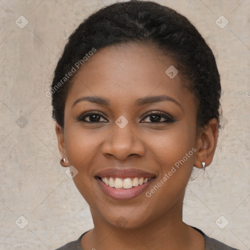 Joyful black young-adult female with short  brown hair and brown eyes