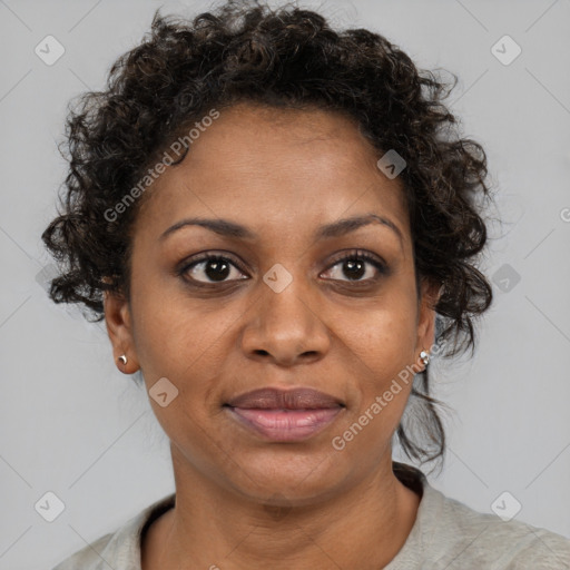 Joyful black adult female with short  brown hair and brown eyes