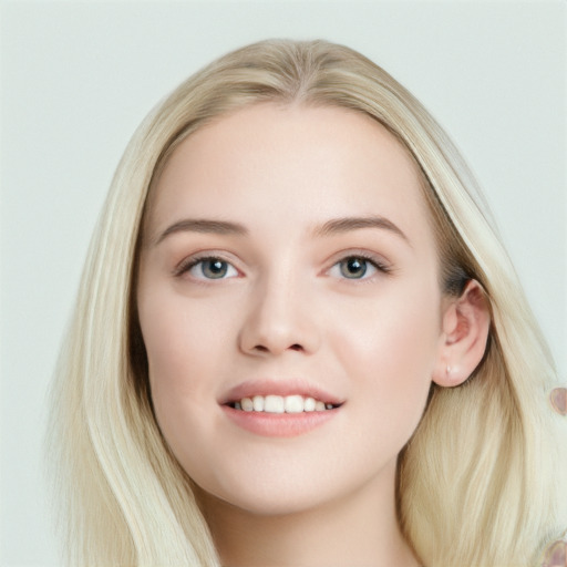 Joyful white young-adult female with long  brown hair and blue eyes