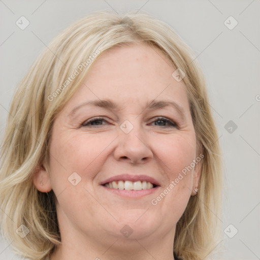 Joyful white adult female with medium  brown hair and blue eyes