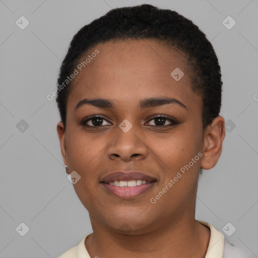 Joyful black young-adult female with short  black hair and brown eyes