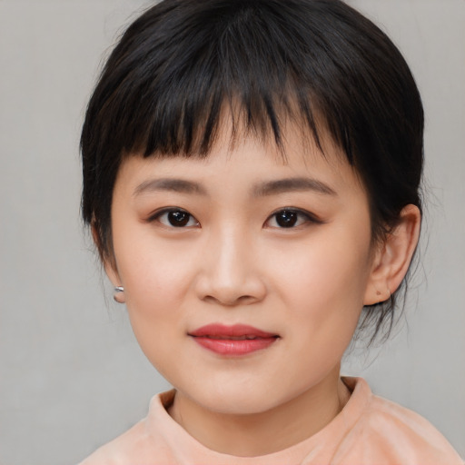 Joyful asian child female with medium  brown hair and brown eyes