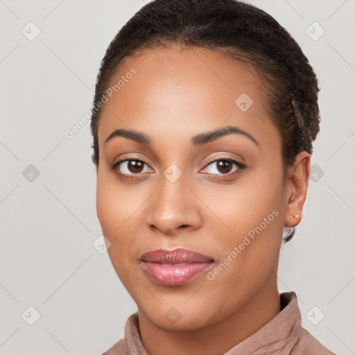 Joyful latino young-adult female with short  brown hair and brown eyes