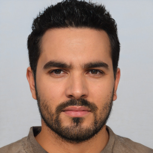 Neutral latino young-adult male with short  black hair and brown eyes